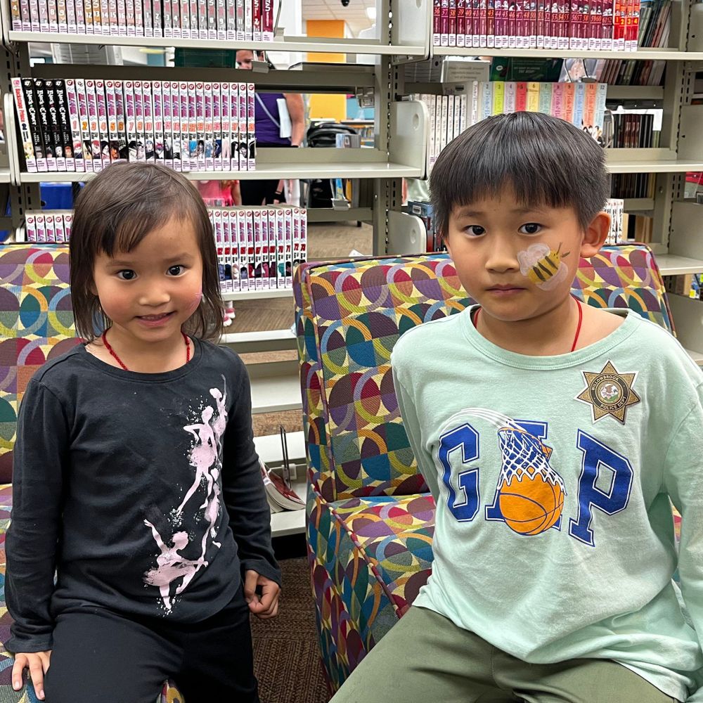Two kids with face paint.