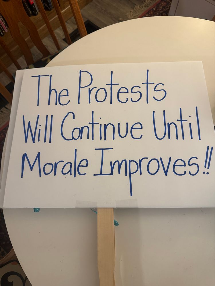 Protest sign that has text: The Protests Will Continue Until Morale Improves!!
