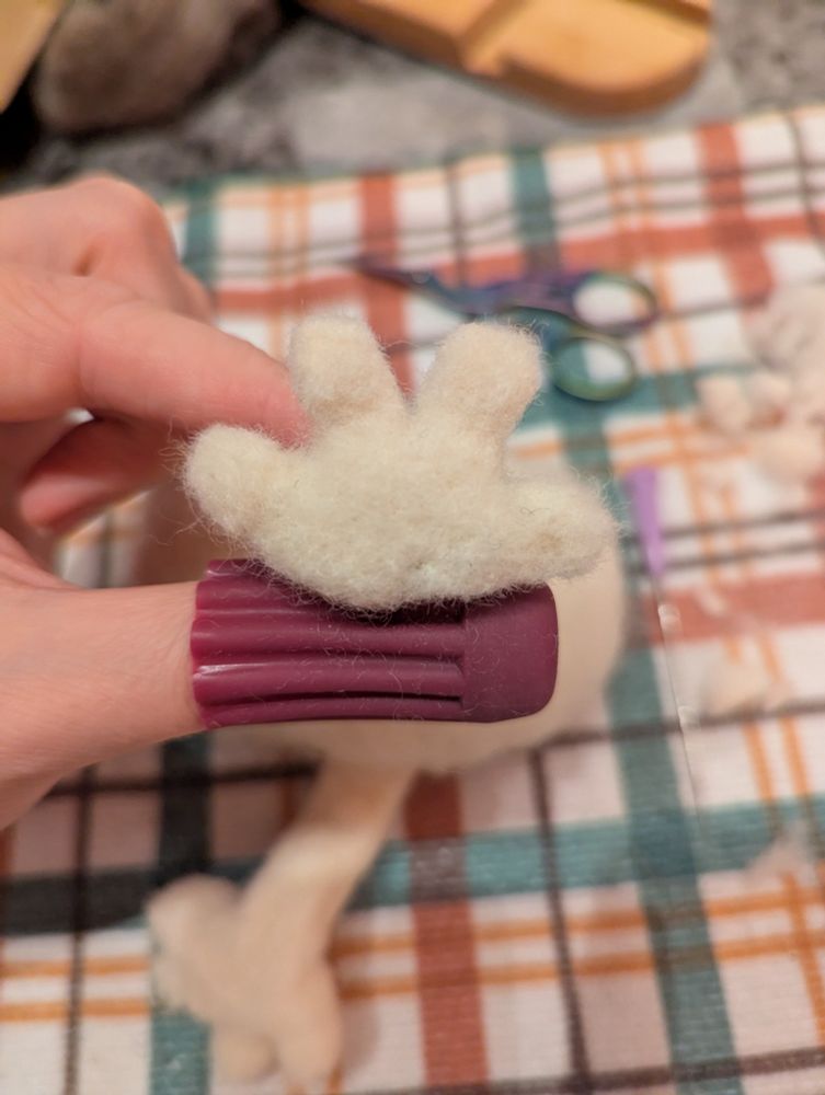Fuzzy white four-toed foot view from below.