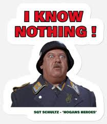 Image of actor John Banner in his most famous role - Sgt. Hans Schultz on TV show "Hogan's Heroes". His catch phrase appears in a speech bubble "I Know Nothing". The character was infamous for closing his eyes to what was going on around him.