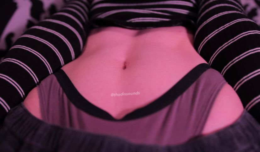 a picture of my tummy with me wearing a striped crop top a pair of brown underwear peeking over my hips :)