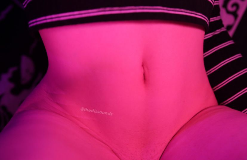 a picture of my tummy and me wearing a striped crop top :)