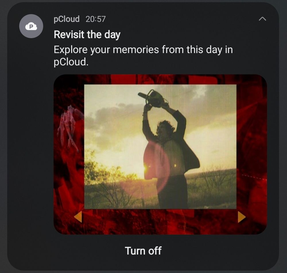 Screenshot of a phone showing a notification from a cloud storage provider promptig to "revisit the day" and showing a picture of a dvd menu that has a picture of a scene from the end of texas Chainsaw massacre
