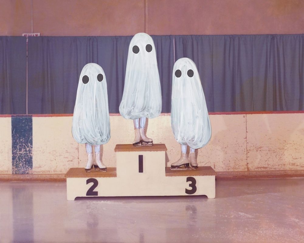 A found photograph of a podium at a school sports event. Three ghosts have won medals.
