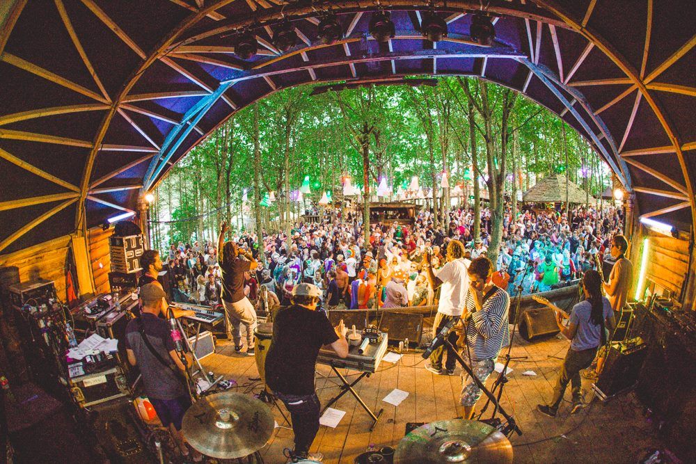 A shot from behind the stage MCs Deman and Flinty aka The ragga Twins down the front hyping the crowd. I'm in the middle in black probably making wild sounds with my percussion synth and space echo.