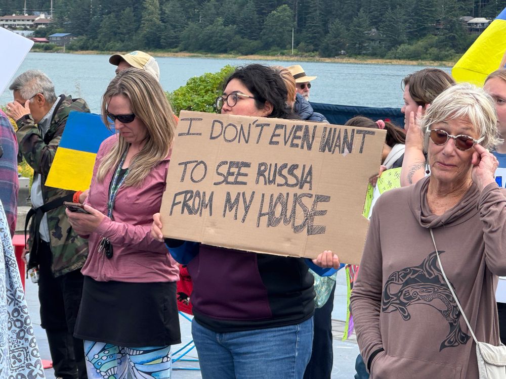 A protest sign held in Juneau, Alaska saying I don’t even want to see Russia from my house. 