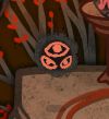 A screenshot showing a closeup of one of the summonable demons from the game The Coffin of Andy and Leyley. It's a small, floating black/grey orb with 3 cherry red eyes. It just gave one of the main characters some very useful advice.