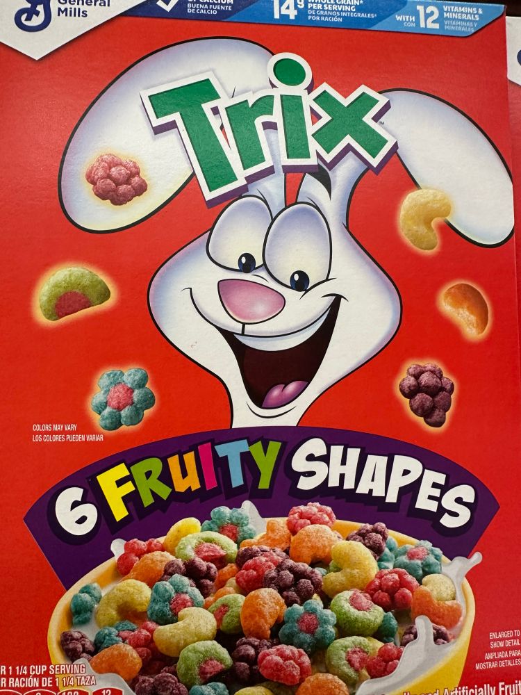 A box of Trix cereal, a banner on it boasts about its “6 Fruity Shapes” 