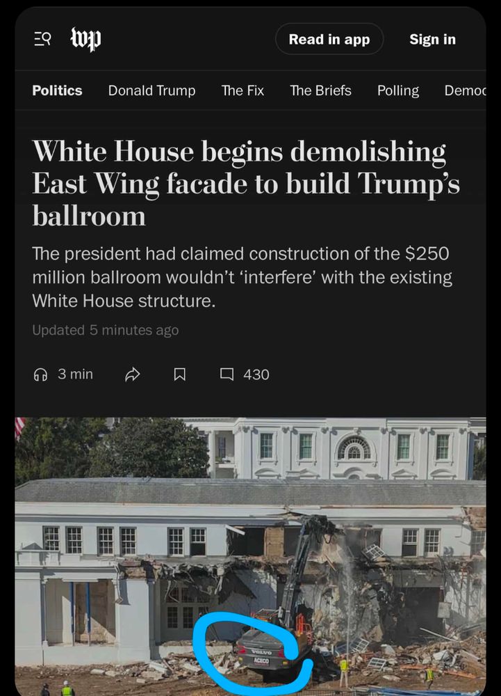 A Volvo back-hoe loader demolishing parts of the White House to build Trump's ballroom.