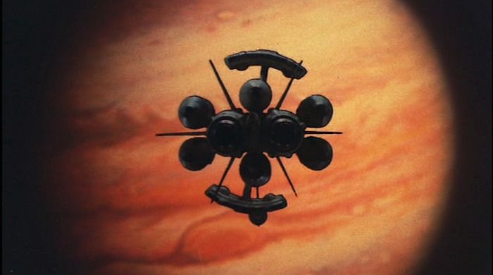 A futuristic spaceship sails towards the planet Jupiter in a scene from Sayonara, Jupiter (1984).
