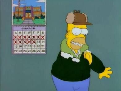 Homer Simpson shivering and brushing snow off his jacket. There is a calendar on the wall behind him; the month reads "Smarch"