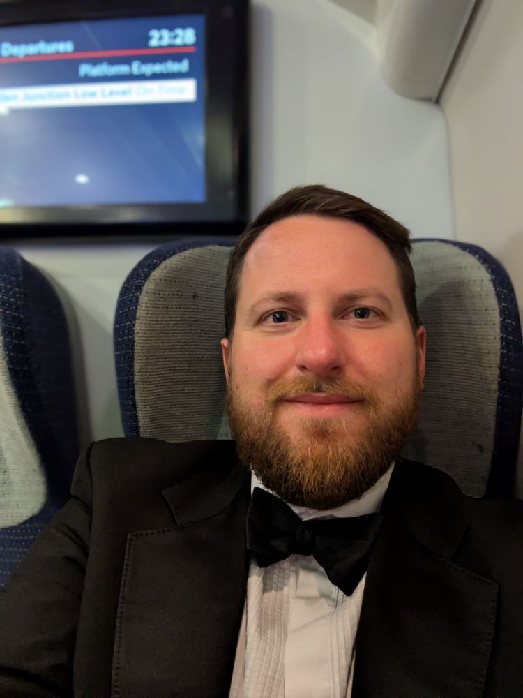 Selfie on train (Avanti West Coast Pendolino). Wearing dinner jacket and bow tie.
