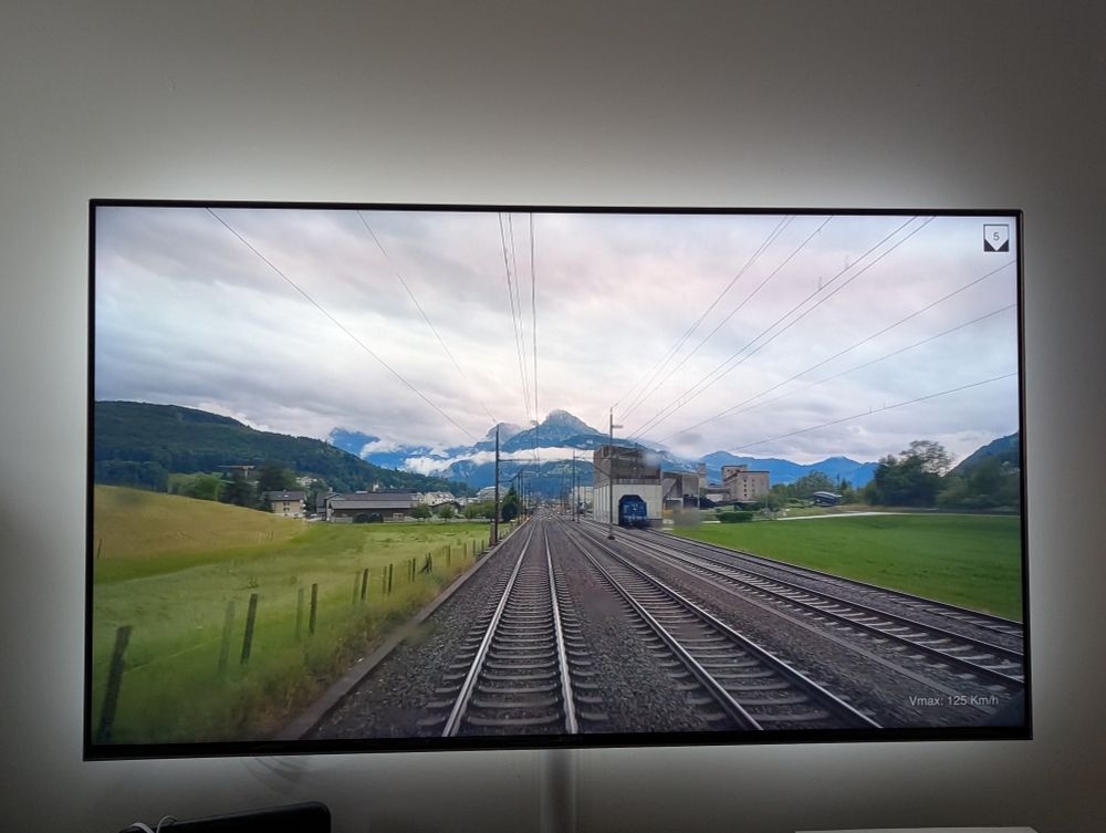 I'm watching cab ride videos of trains in Switzerland. The view: tracks, mountains.