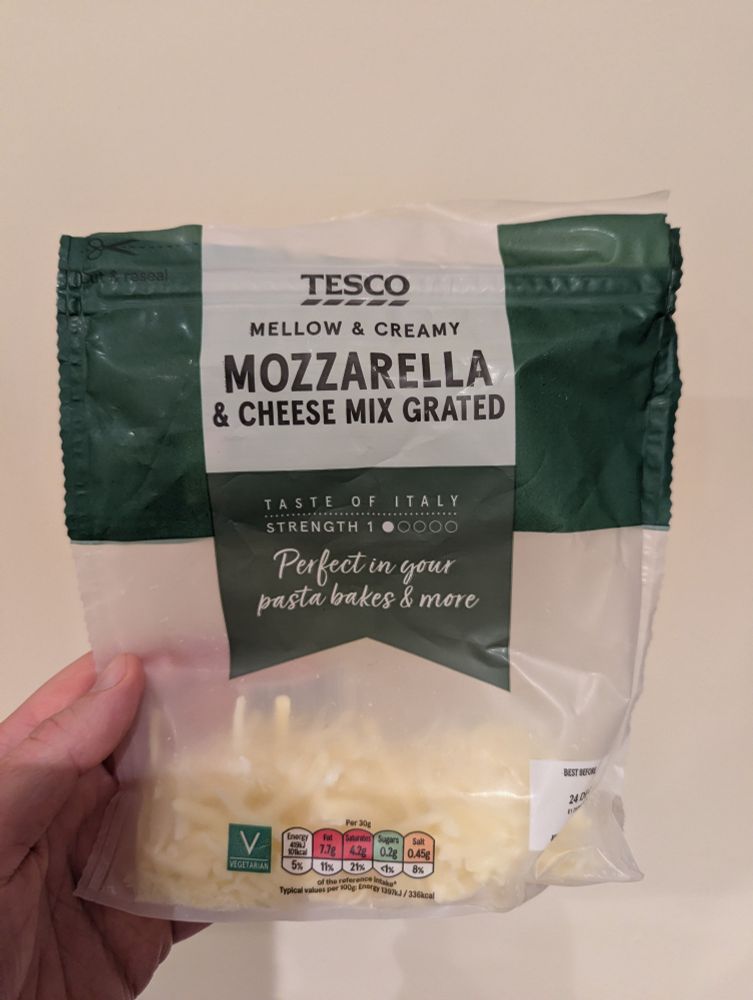 Sachet of pre-grated cheese from Tesco. Titles: large font "mozzarella", then smaller font "& cheese mix grated". "taste of Italy. Perfect in your pasta bakes and more."