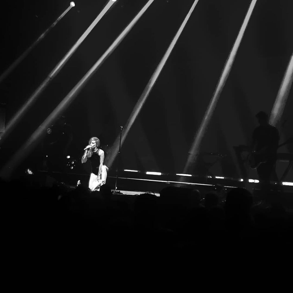 Black and white photo of Lights with light beams 