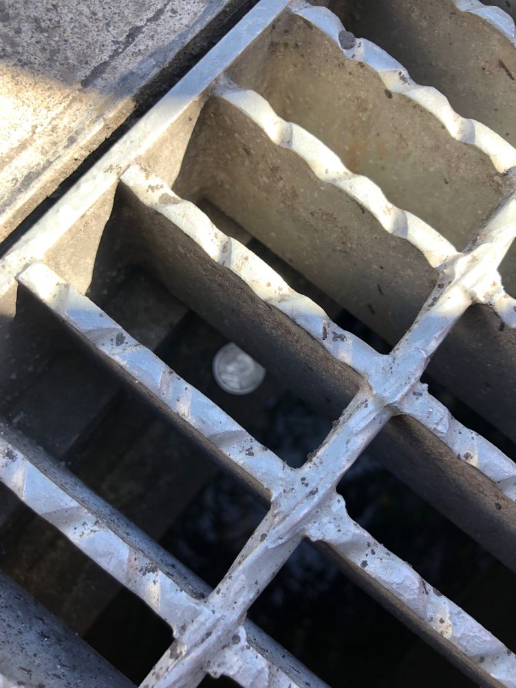 a five dollar coin in the drain