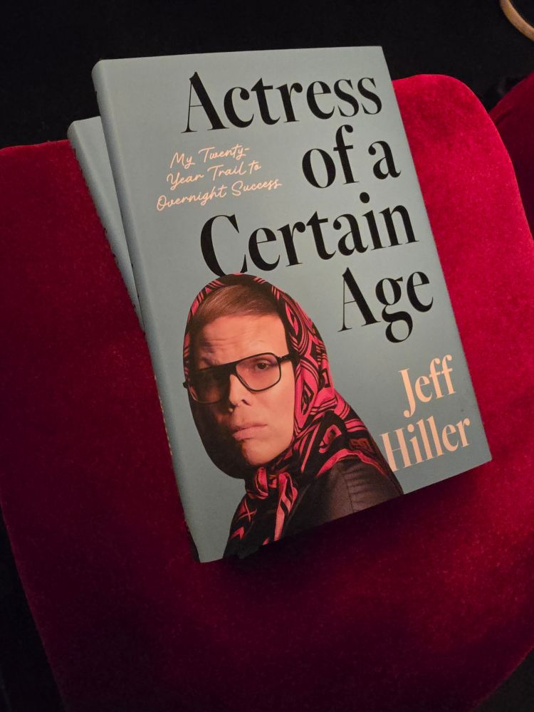 Jeff Hiller's book Actress of a Certain Age on a theater seat.