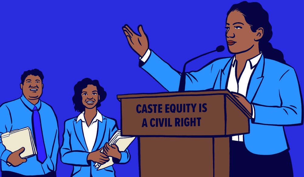 Fly Dalit feminist organizer in a blazing blue jacket is giving a speech on how caste equity is a civil right to mobilize other caste oppressed people!