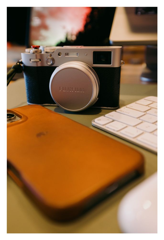 Fuji X100VI in a pic on a desk
