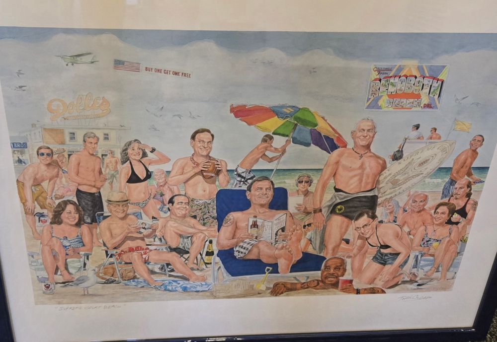 A painting of lots of white people in swimsuits at the beach. A closer look reveals that they are mostly supreme court justices. Clarence Thomas is in the foreground apparently buried in the sand. Obama is walking in the back