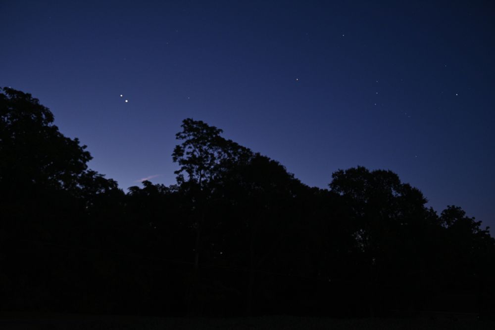 A wide angle shot (33mm) of the conjunction of Venus (lower right of the two bright objects to the left) and Jupiter. To the right you can see Orion for scale.