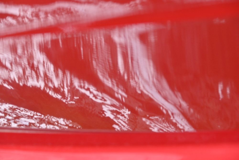 A close-up up of reflections off of a boat.