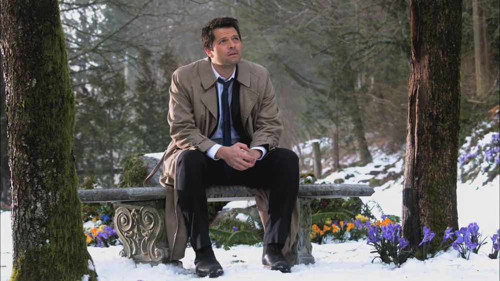 Castiel sitting on a stone bench in a snowy garden with trees and spring bulbs. He is looking up to heaven.

The Man who would be King.
