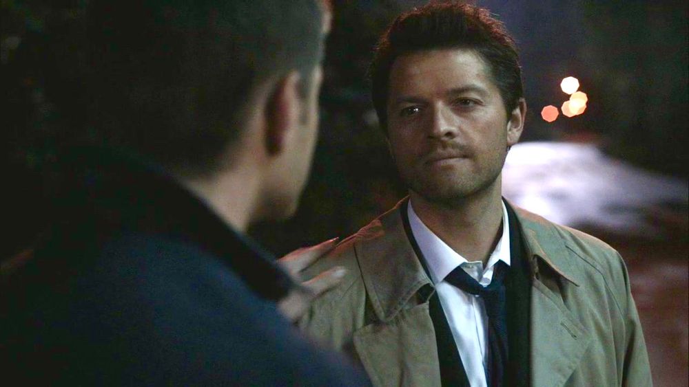 Castiel still smiling at Dean, The End. Dean has his hand on Cas’s shoulder.