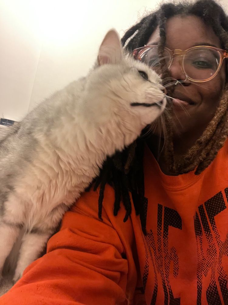 My cat Case rubbing against my face