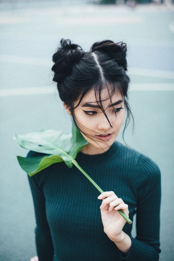 Original photo by Natta Summerky. 
The woman is holding up a monstera leaf in her left hand, over her right shoulder. Her face is a little bigger and more heartshaped than I ended up drawing it.