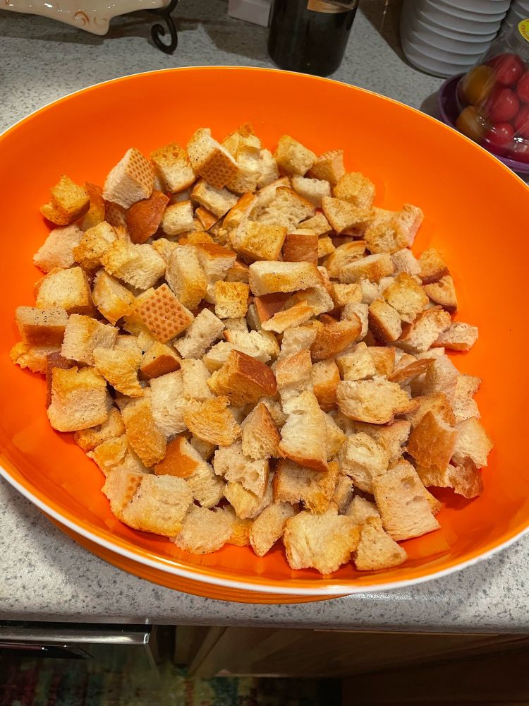Baking sheet full of cubed bread