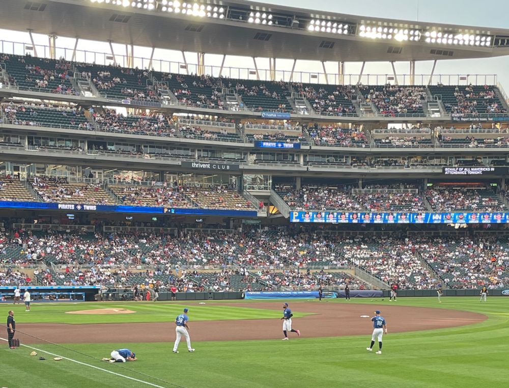 Members of the Minnesota Twins warming up at Target Field