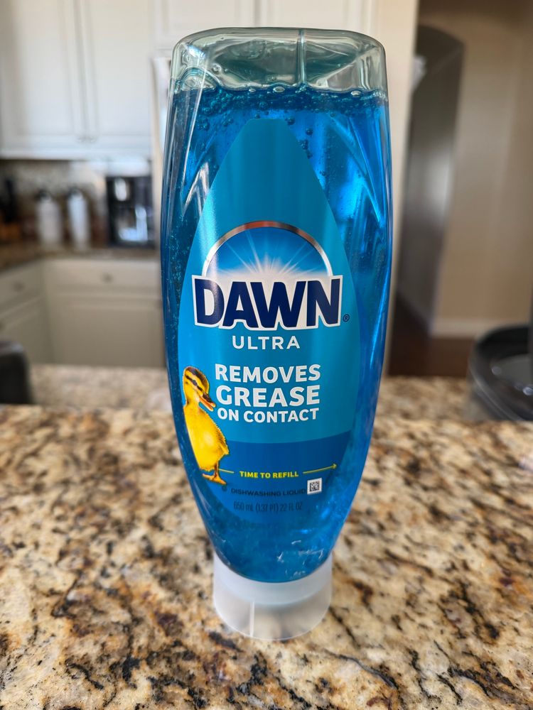 Bottle of Dawn dish soap that dispenses from the bottom
