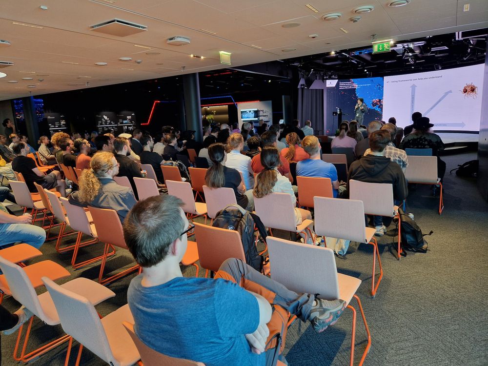 Stephen in front of a framework diagram with axes Flying-ness (altitude?), Monstrousness, and Spaghetti-ness. And the Flying Spaghetti Monster for good measure. 