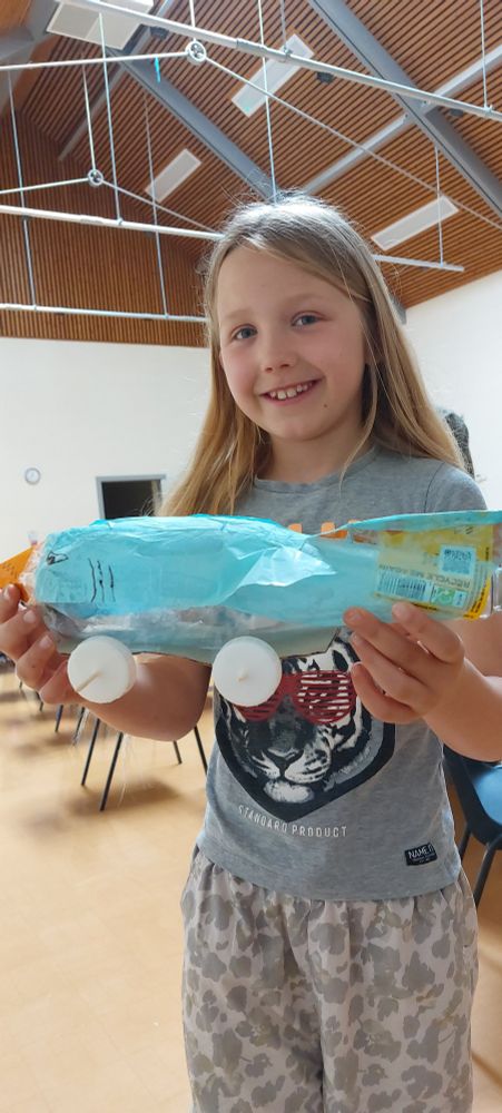 Young Girl proud of her car