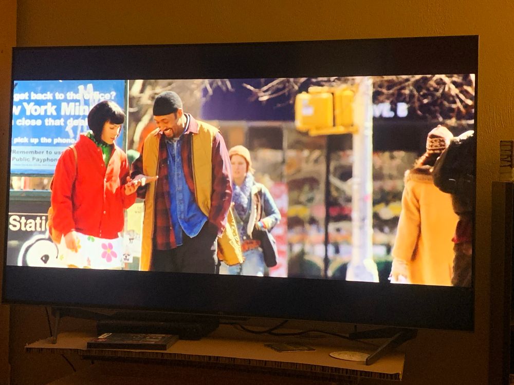 Tom Collins and Angel walking along the sidewalk and being adorable 