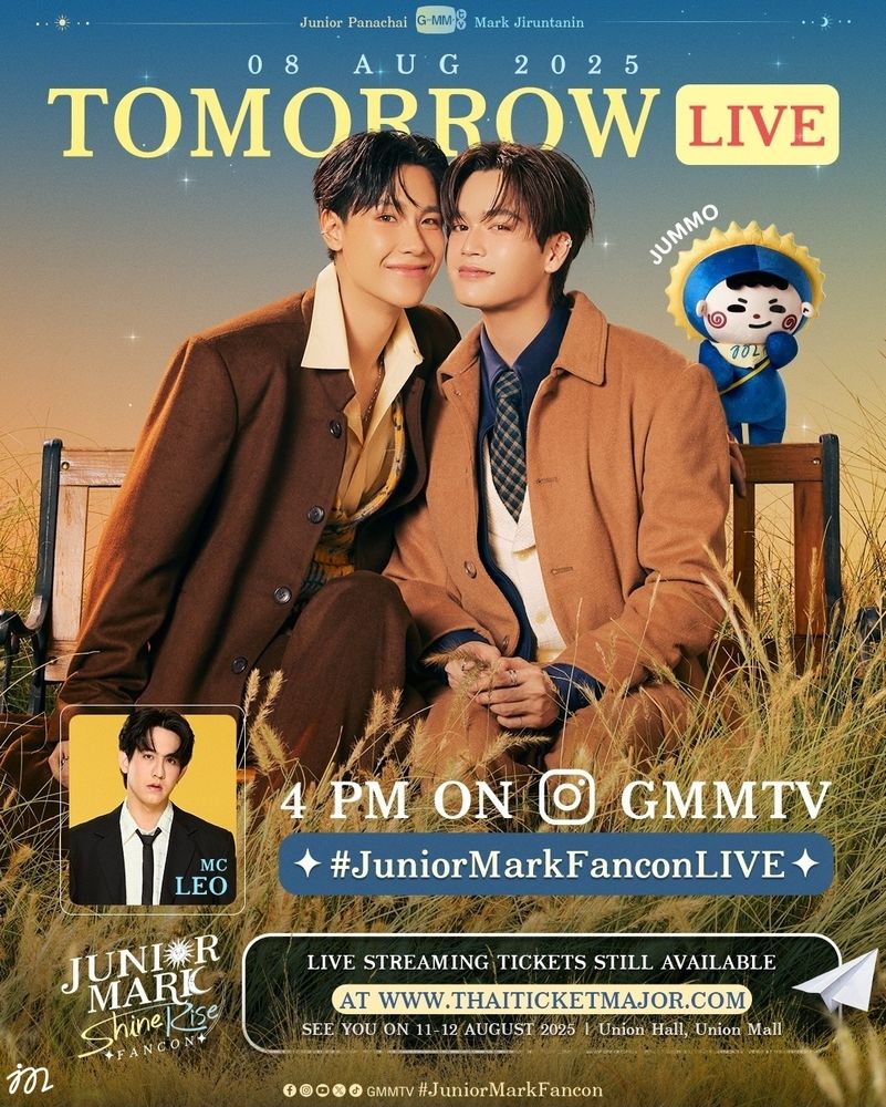 A screenshot of a poster for Junior and Marks IG Live scheduled for Friday, August 8th at 4p.m. (thai time) on GMMTVs IG account. #JuniorMarkFanconLIVE
Junior and Mark are sitting on a bench, both wearing variations of brown. Long grass is in front of them. Their character Jummo is standing on the bench back behind Mark.
