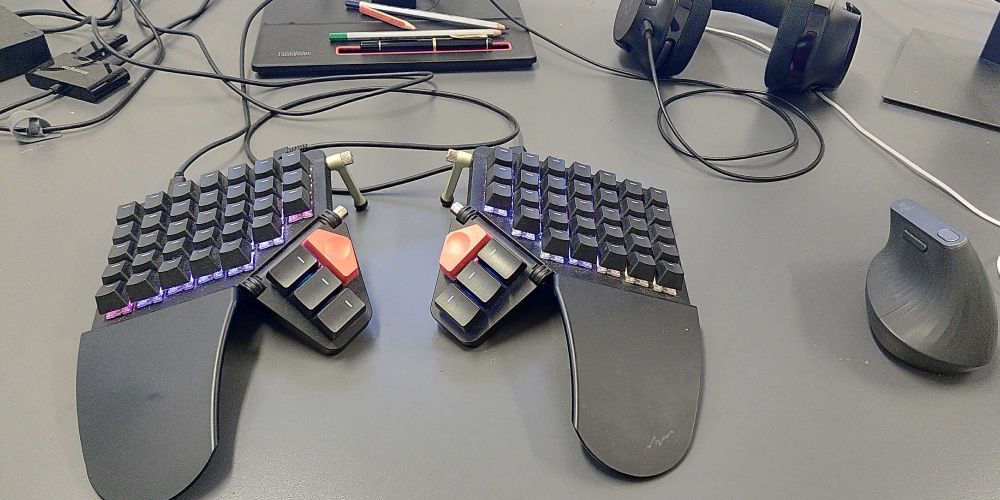 A dirty looking keyboard on a desk.