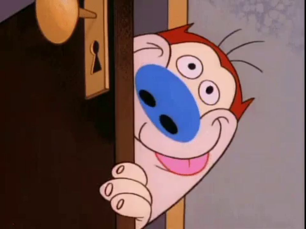 a cartoon character with a blue nose peeking out of a door .