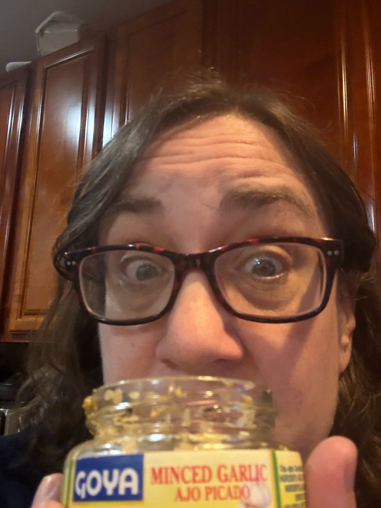 Picture of me NOT smelling a jar of garlic because I have covid. 