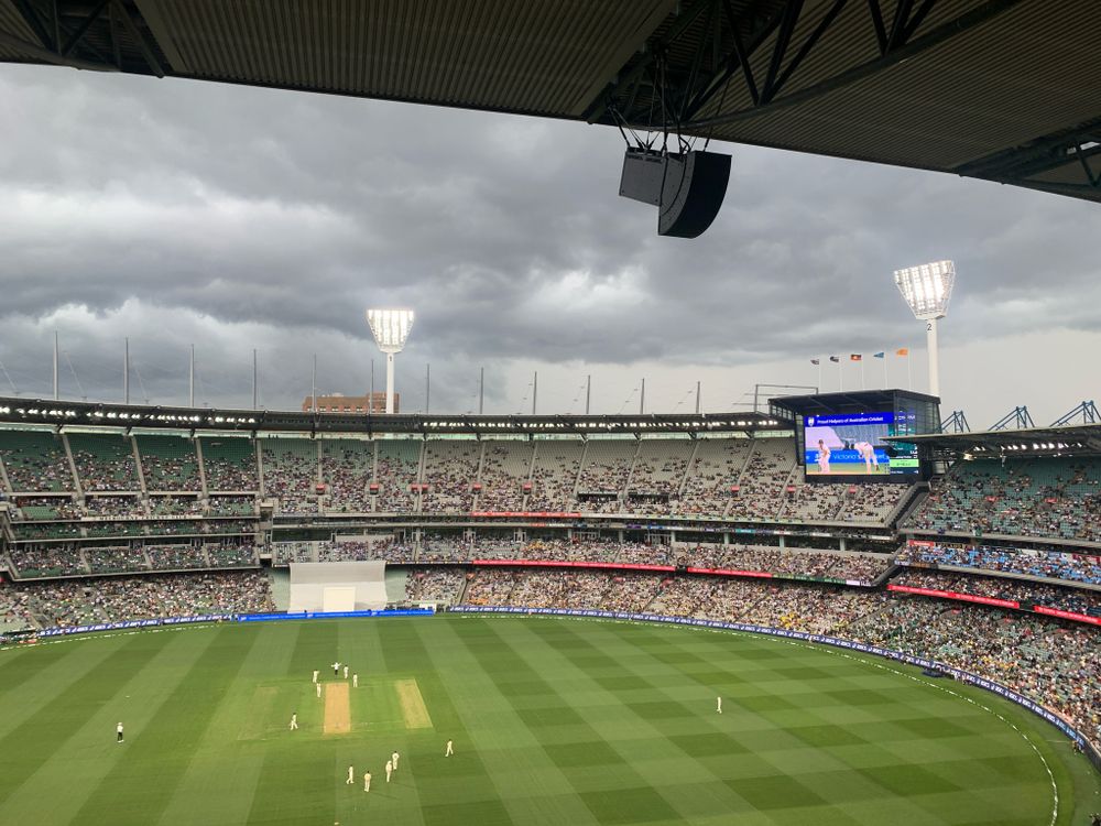 The MCG under an ominous stormy looking sky.  The lights have been turned on.