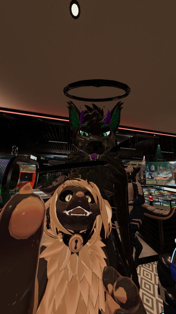 Selfie from VRChat with Notkea Sketch and Seif Doggo. Notkea with a shocked expression as both Notkea and Seif has a goopy black halo on their heads.
