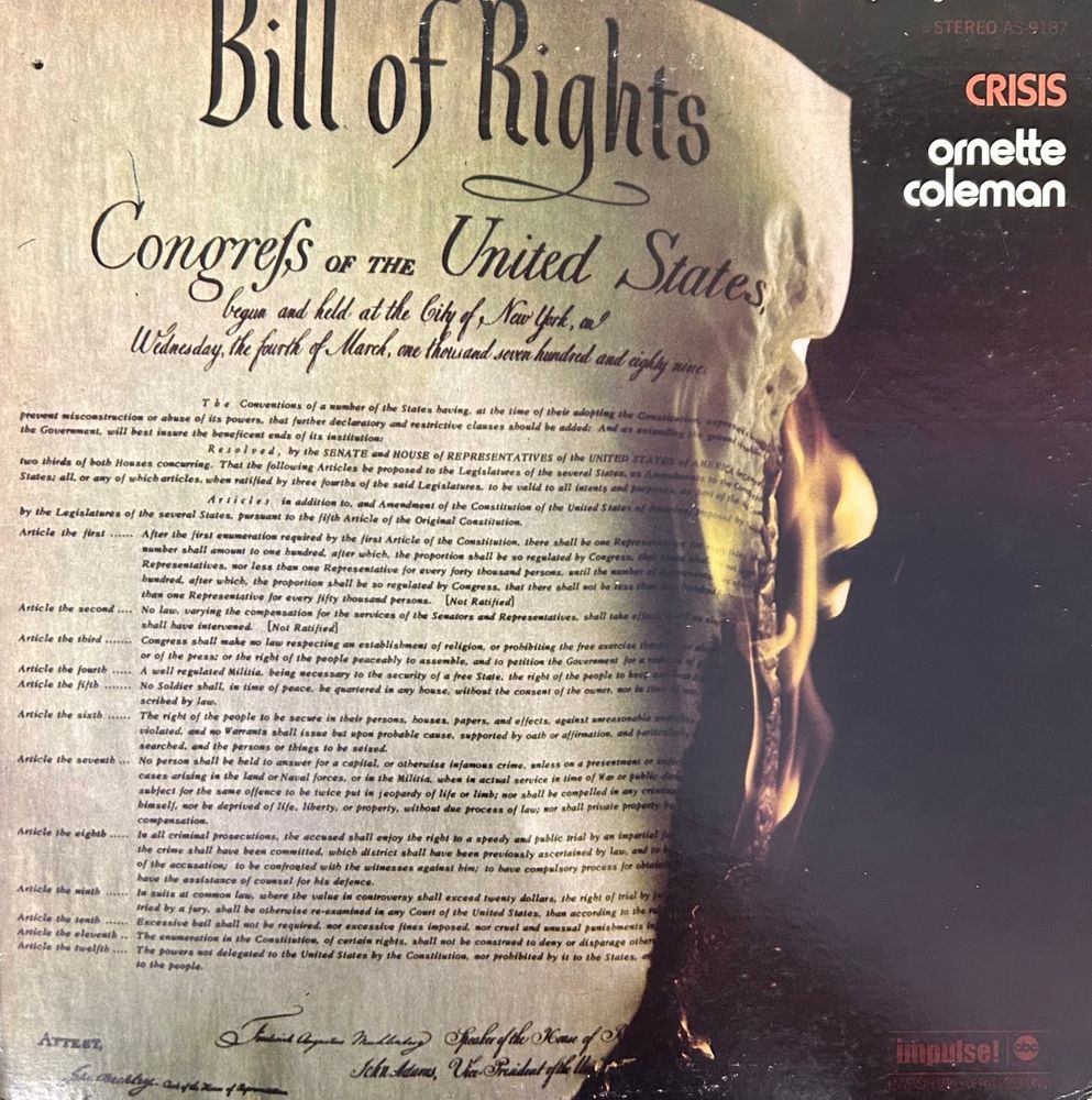The album cover of the album "Crisis" by Ornette Coleman showing the Bill of Rights on fire.