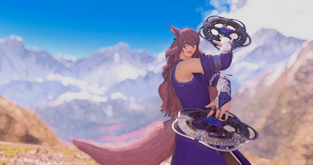 Soorhi'wo stands at the ready in a blue gown wielding wrought iron chakrams, backdropped by mountains.