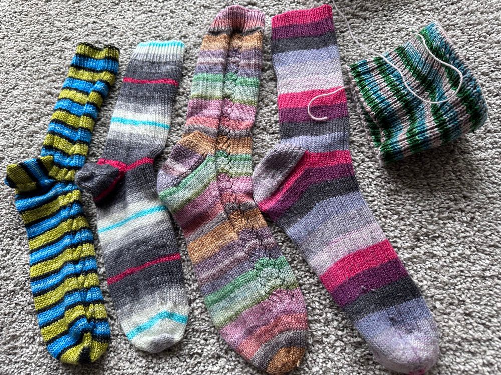 Four striped pairs of handknit socks