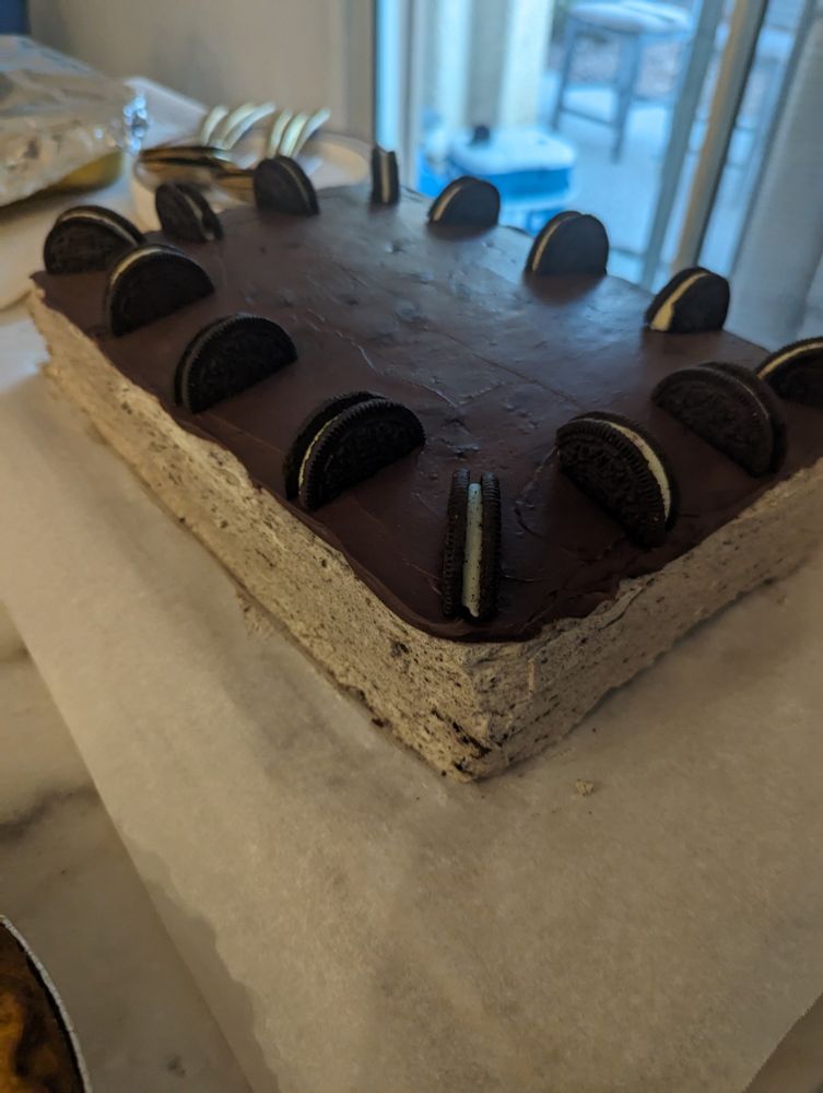 Chocolate Oreo cake with Oreo cream cheese frosting. Topped with ganache and Oreo cookies.