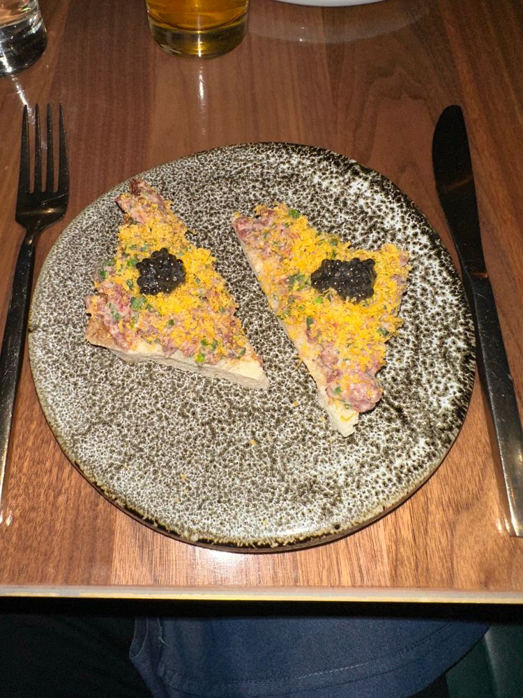Steak tartare on toast topped with roe caviar. At this stage in my life I am accustomed to plainer fare but it was enjoyable. 
