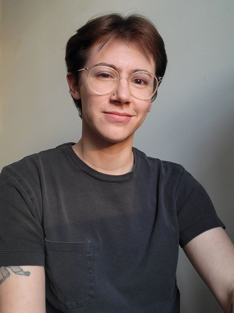 golden hour selfie in a black pocket tee