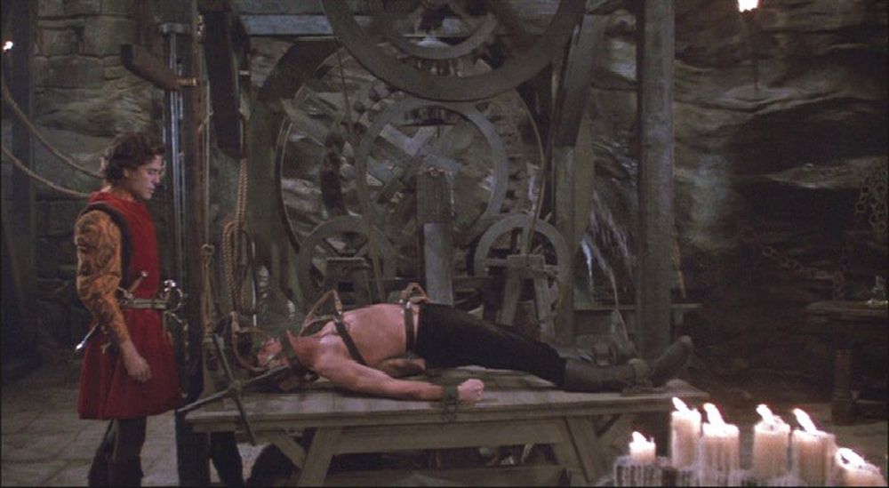 the machine from Princess Bride with Wesley strapped down arching his back while Humperdink stands over him like some kind of night poop enforcer