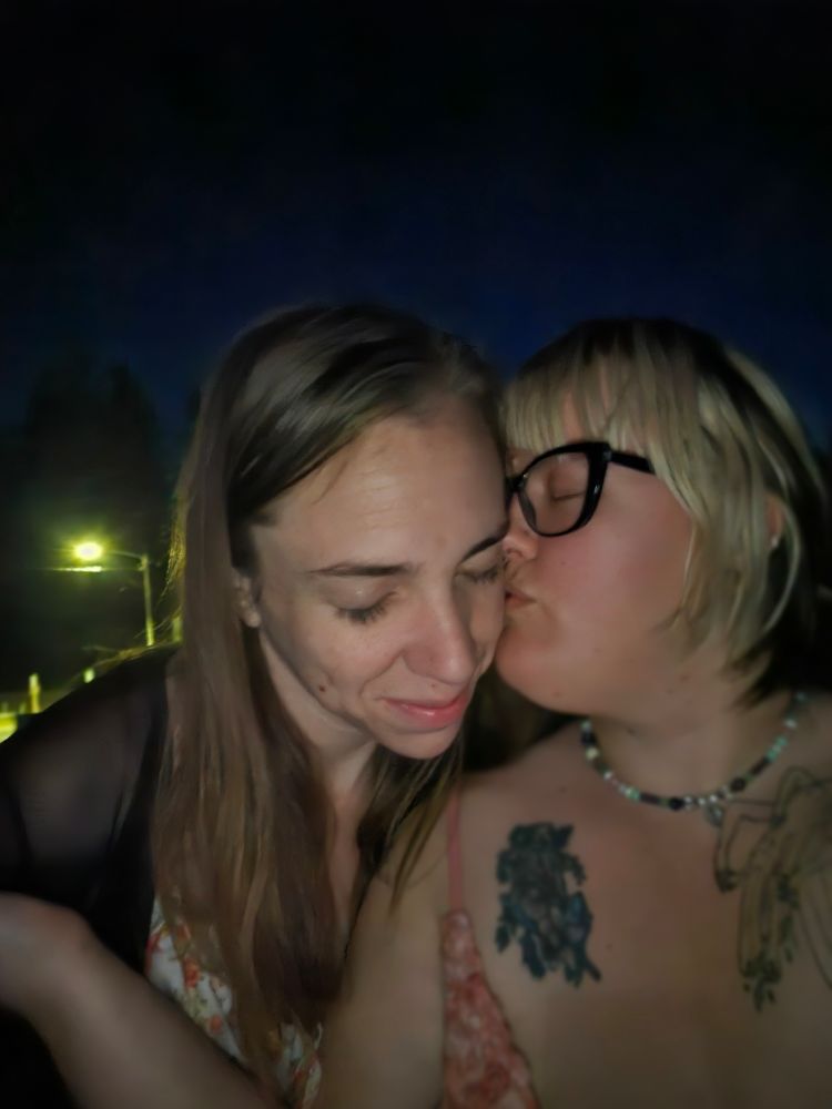 A sapphic couple late at night